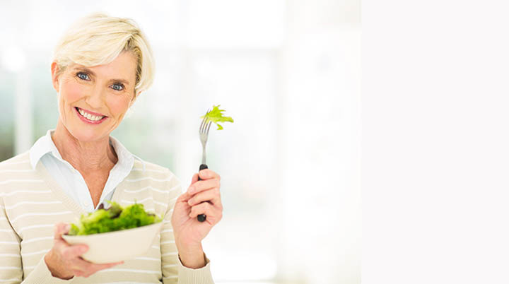 Woman eating salad